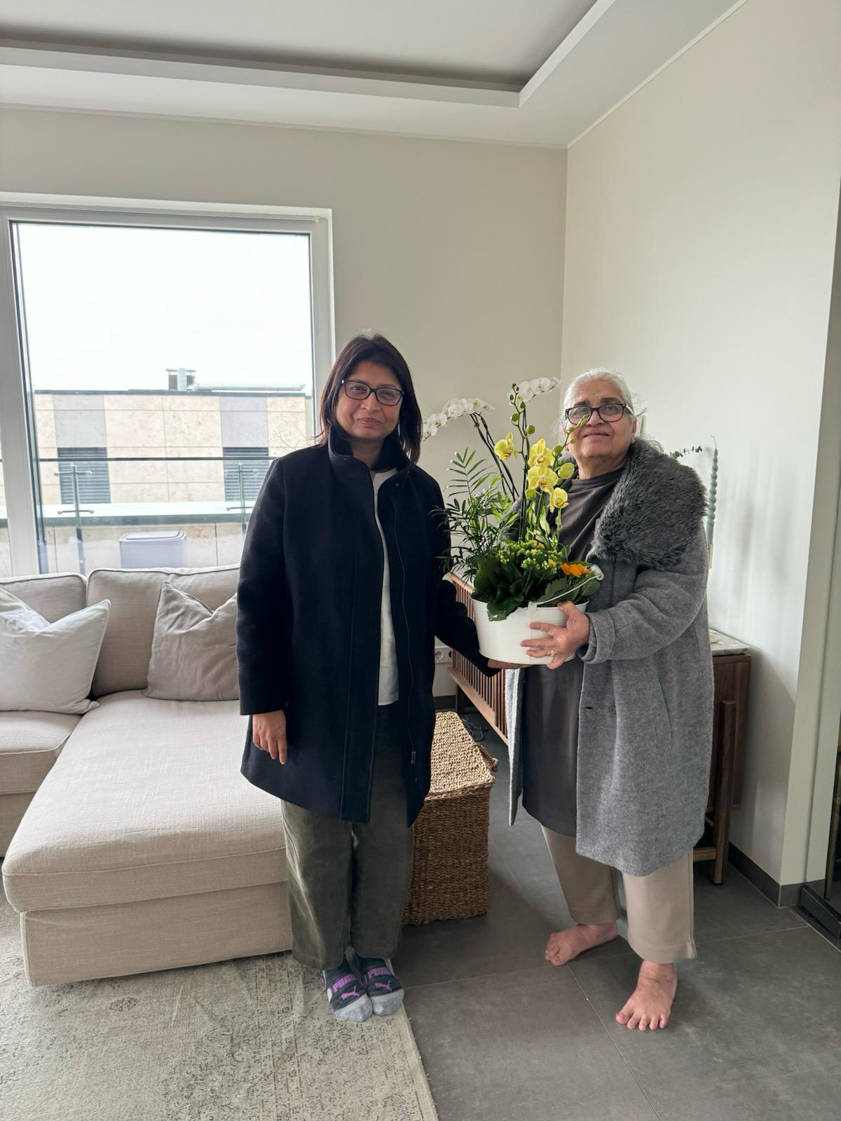 Bagya arranging tableware in a cozy home setting