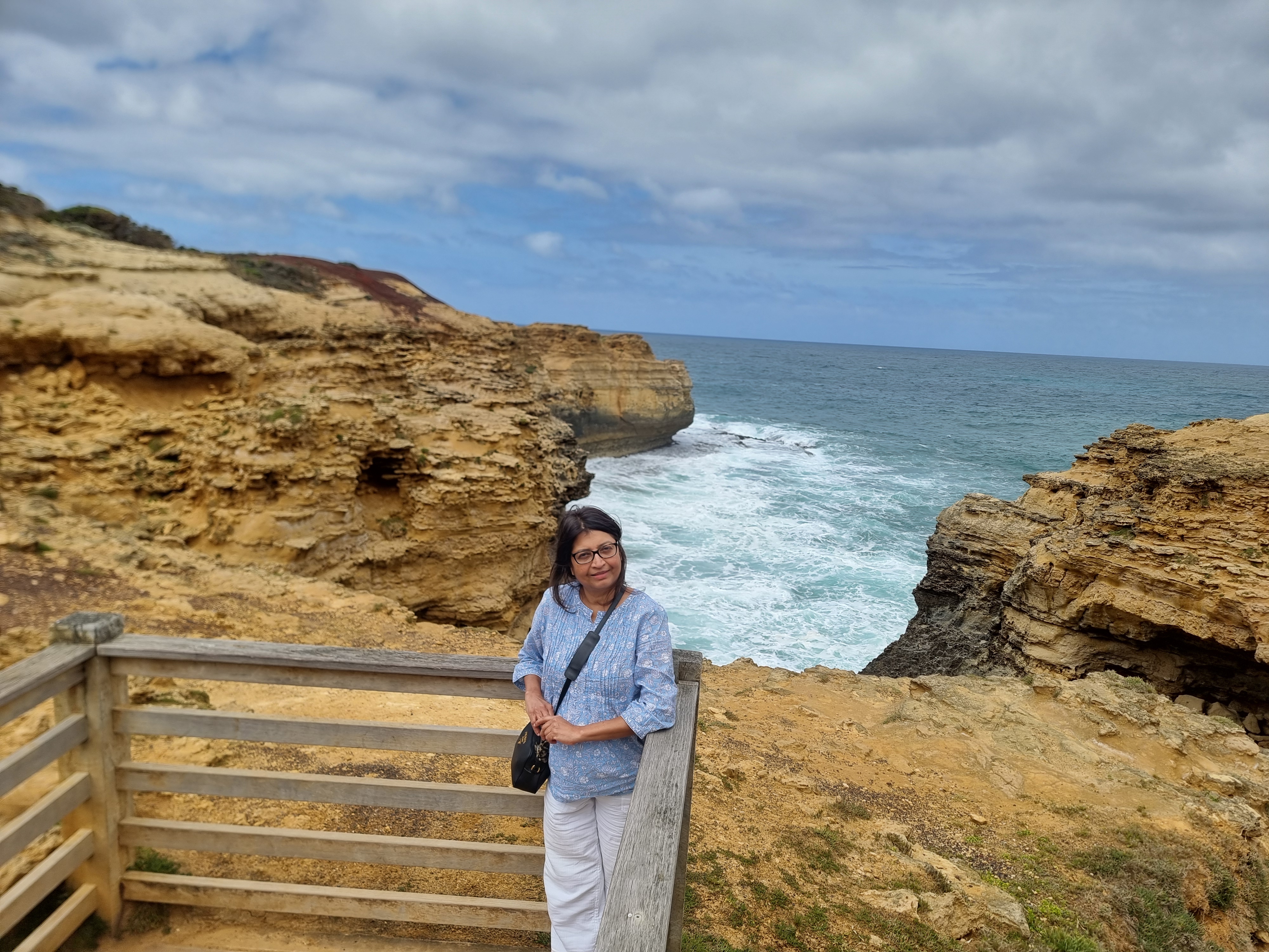 Weekly planner and notebook beside tea cup
