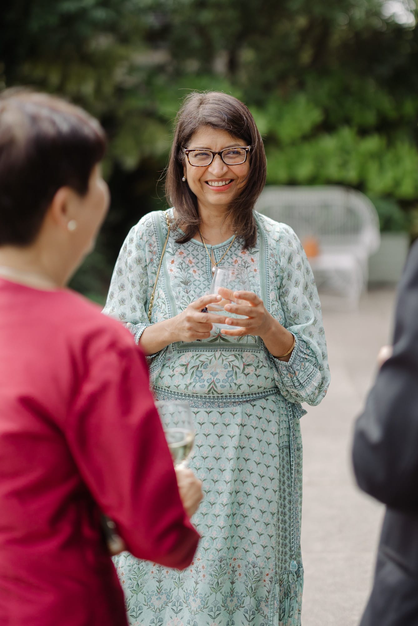 Bagya smiling at an outdoor family gathering